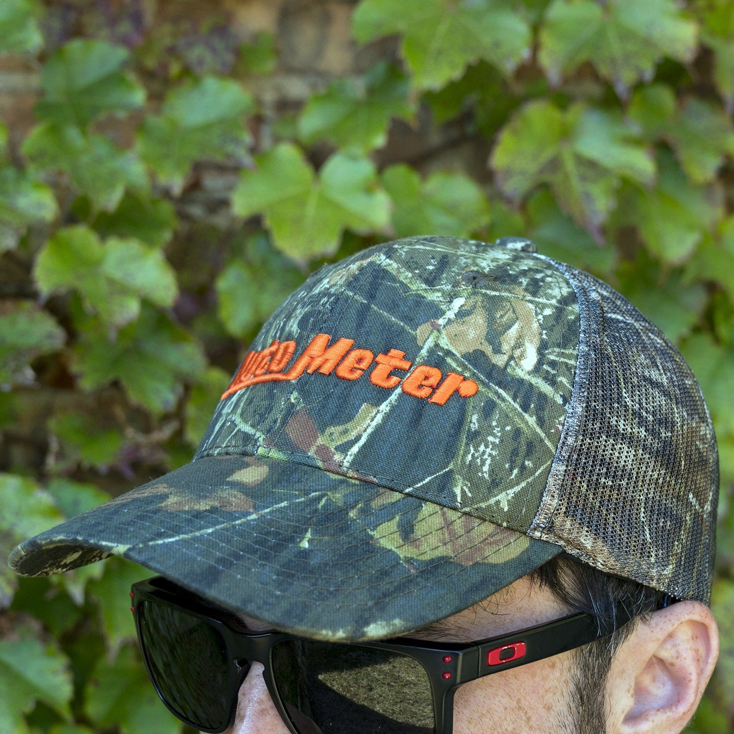 HAT, MESH BACK W/VELCRO, HUNTING CAMO, BLAZE ORANGE 'AUTOMETER'